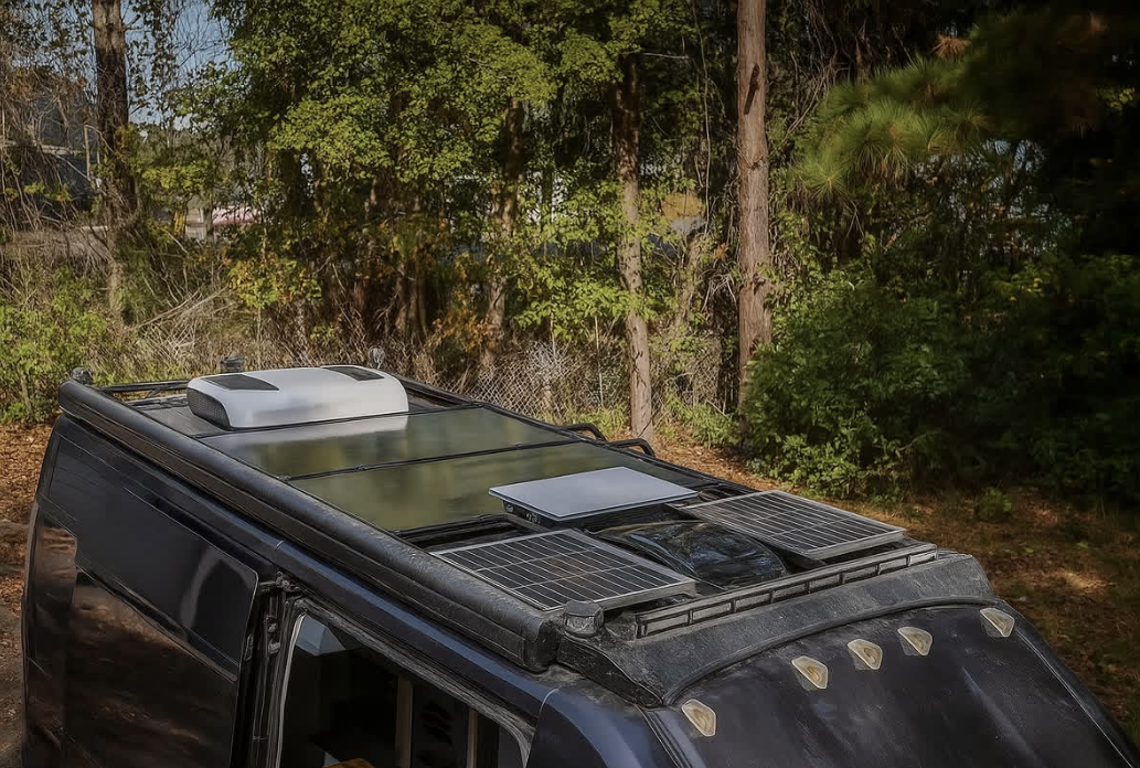 Solar panels and Starlink equipment installed on a custom camper van roof
